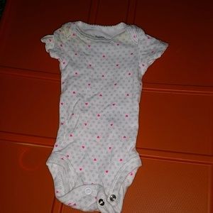 Precious Firsts size newborn onesie.
